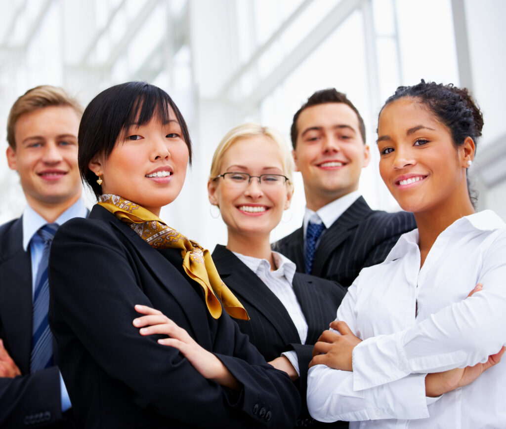 Business professionals standing together in an office