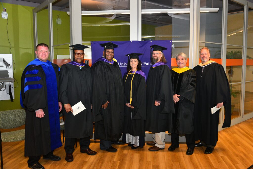 Graduates in academic regalia at commencement